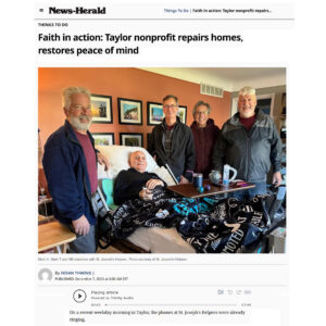St Joseph's Helpers volunteers pose with a client, after installing several ramps donated by the Knights of Columbus.